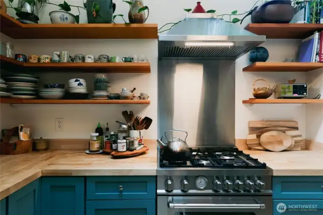 All newer appliances and open shelving help keep this kitchen nice and bright.