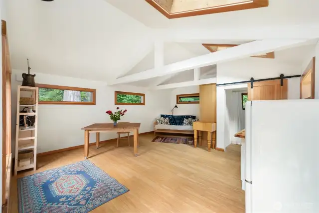 Guest cottage/ MIL has thoughtfully placed windows and bamboo composite floors. Stay cozy in the winter and cool in the summer with the mini split.