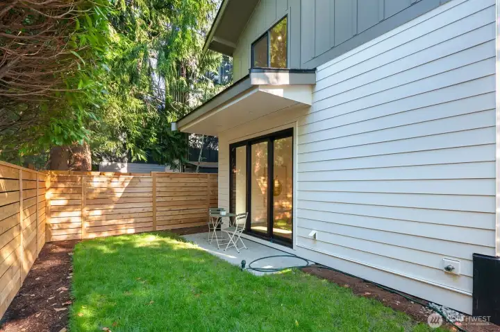 Another shot of the fully fenced, level backyard of the detached home.