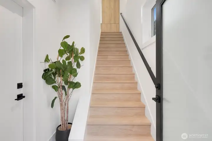 This photo shows the stairs just as you enter the carriage house. The door on your left takes you into the garage.