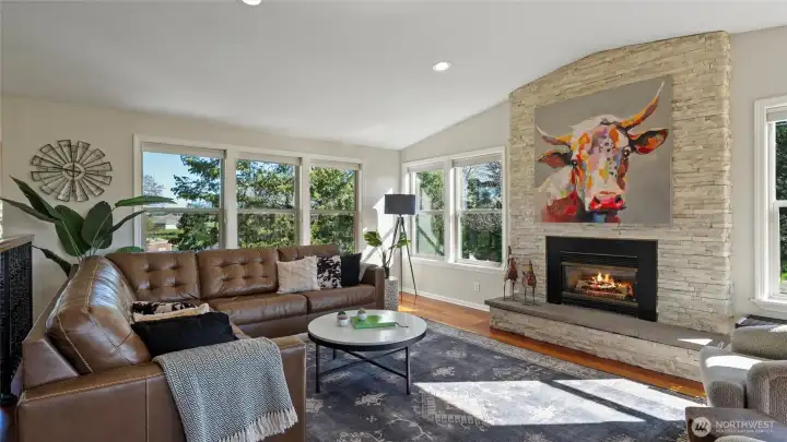 Beautiful stone fireplace with natural gas insert and elegant hearth.