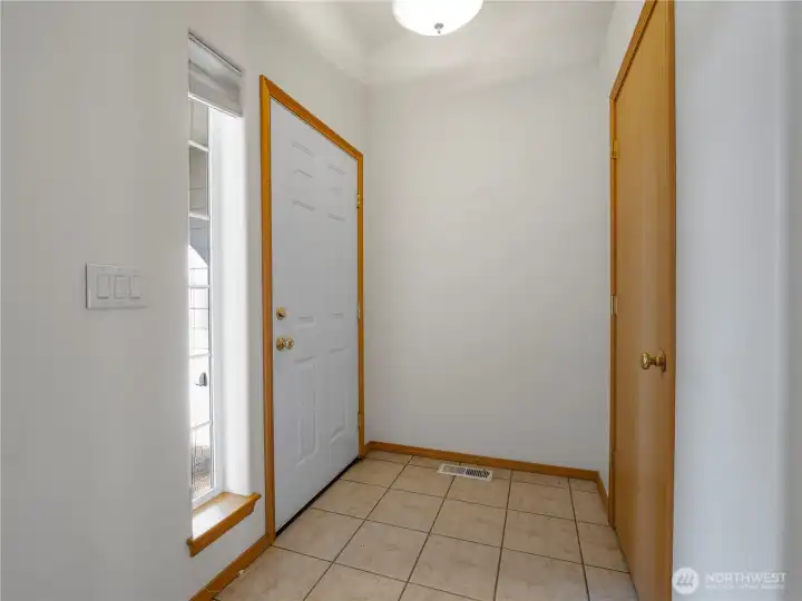 The entry has tile flooring for durability and easy cleaning.