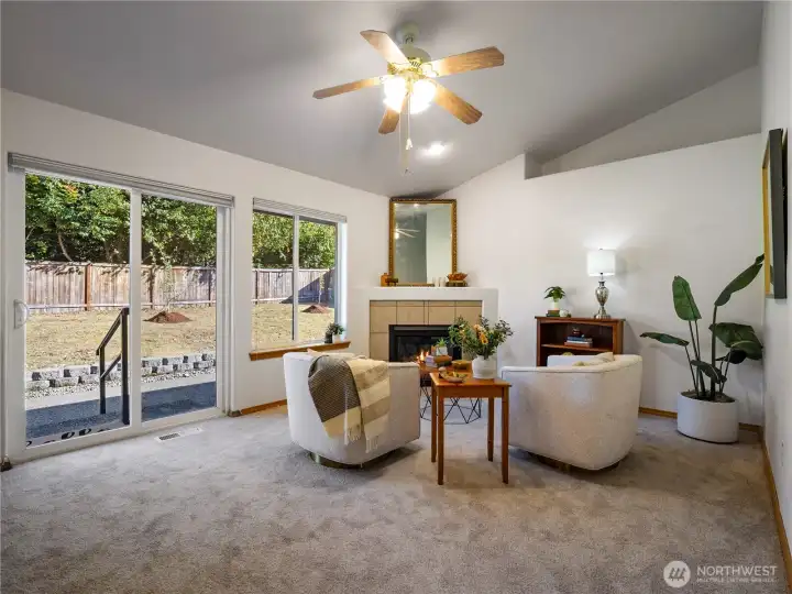 The family room has a view of the back yard and you can sit and enjoy a good book infront of the gas fire.