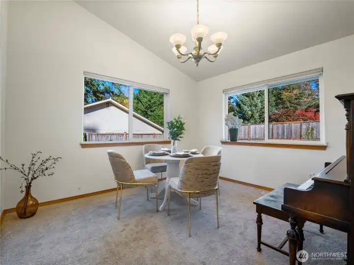 The separate dining room allows for private dinner parties. If you have a pianist in the group, the piano could convey with the home.