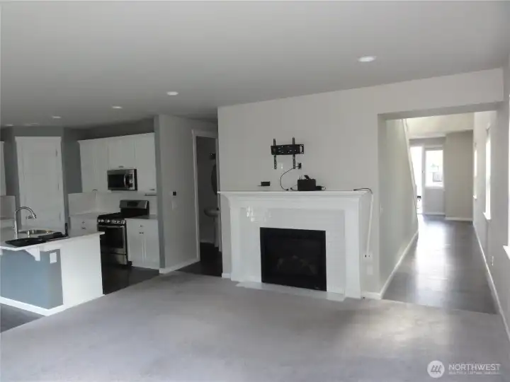 Open concept kitchen and living room. Gas fireplace.