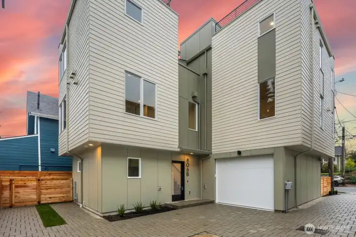 Garage is accessed from the driveway/courtyard area. The ADU (806B) entrance is just to the left of the garage.