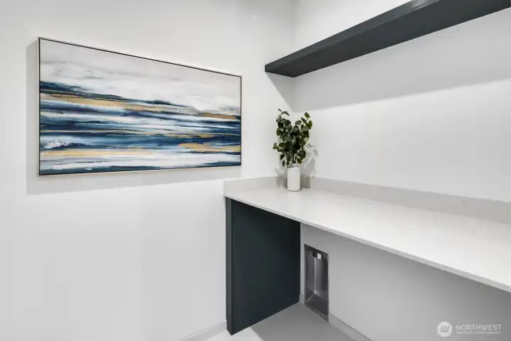 Laundry room with folding table.