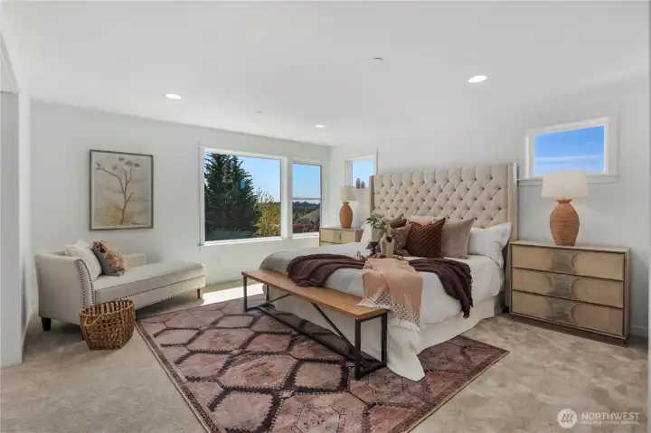 Primary Bedroom: The spacious primary retreat offers an airy layout with large windows that frame natural light throughout the day. Plush carpeting and a versatile sitting area make this room both functional and luxurious, perfect for unwinding in comfort.  Staged photos are of the model home of the same floorplan within the Foxmoore community and are for visualization purposes only. Colors, finishes, and layout can and will vary.