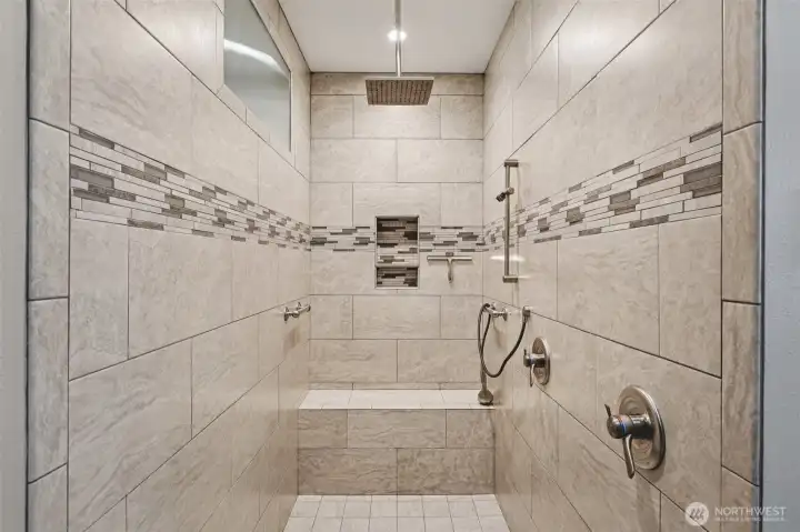 Large walk-in double shower in the remodeled primary bathroom.