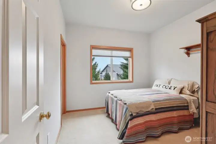 Versatile bedroom space with walk-in closet.