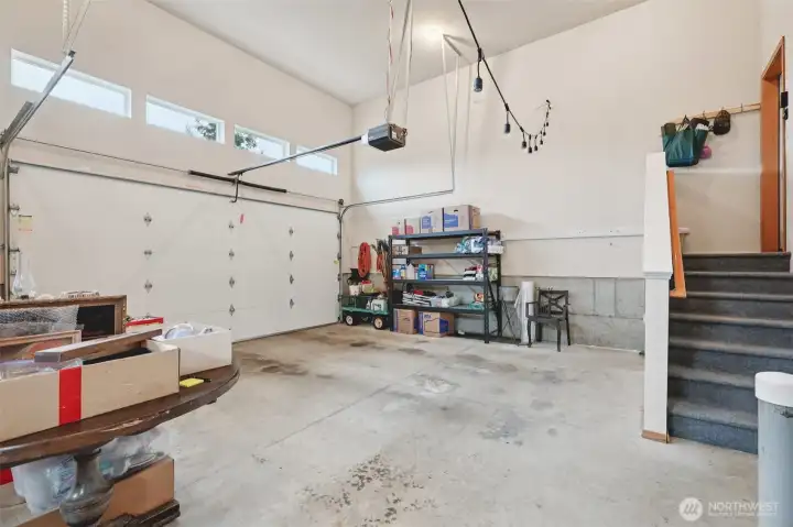 Expansive garage space ideal for vehicles, storage, or workshop.