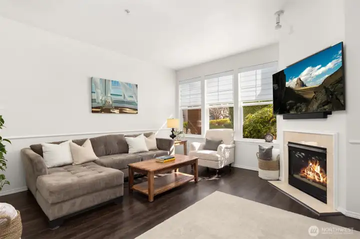 Cozy gas fireplace and high ceilings.