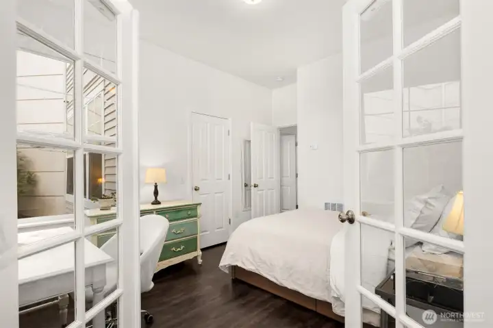 Flexible floorplan. Guest bedroom with French doors.