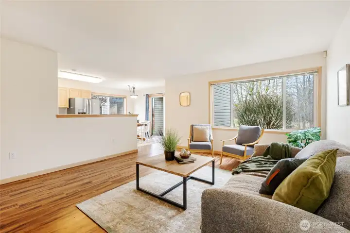 Open concept living with living, dining, and kitchen.