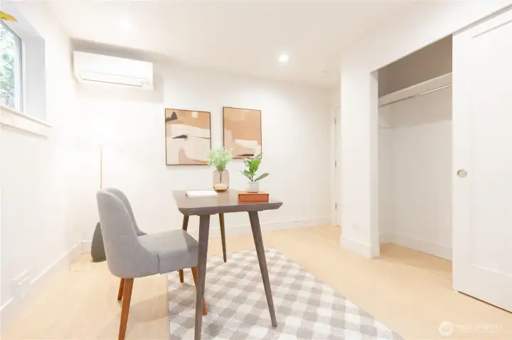 2nd main floor bedroom. Staged as an office space.