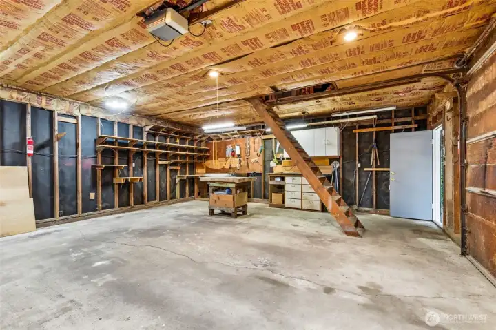 Large garage with shop and access to storage loft