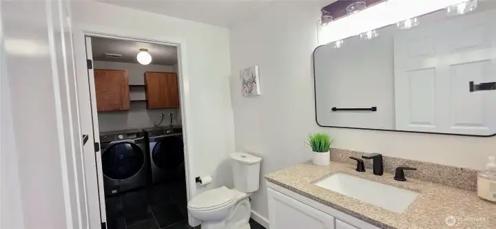 Lower bathroom and laundry room.