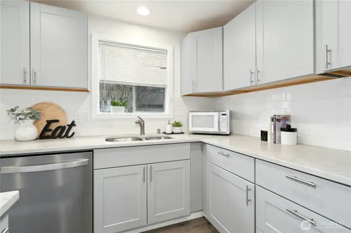 Garden window and subway tile.