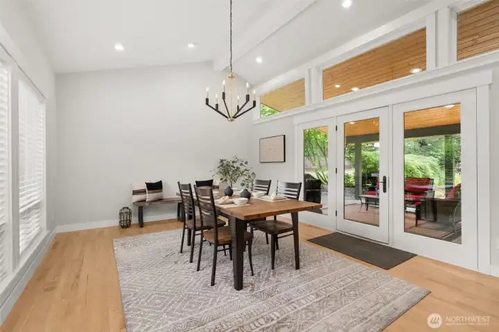 Dining room with double doors leading to the covered gazebo, perfect for indoor-outdoor entertaining. Dining room with double doors leading to the covered gazebo, perfect for indoor-outdoor entertaining.