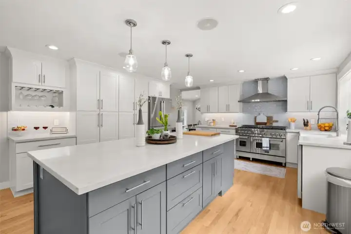 Remodeled kitchen with oversized island and quartz counters. Remodeled kitchen with oversized island and quartz counters.