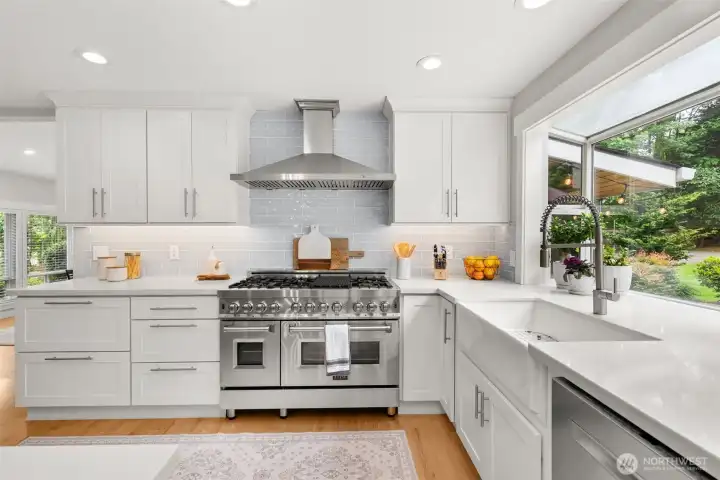 Luxury kitchen with professional-grade range and farmhouse sink. Luxury kitchen with professional-grade range and farmhouse sink.