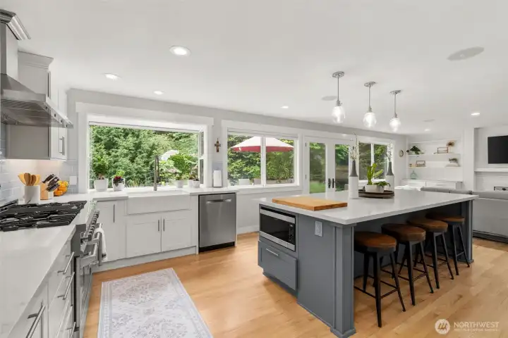 Spacious island kitchen with abundant storage and seating. Spacious island kitchen with abundant storage and seating.