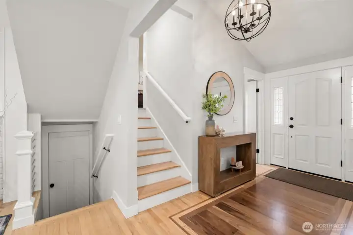 Staircase connecting the main living area to the garage below and bedroom wing above. Staircase connecting the main living area to the garage below and bedroom wing above.