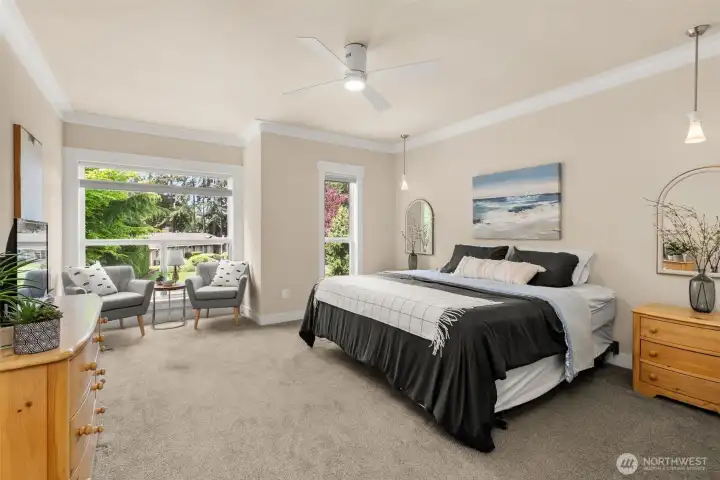 Spacious primary suite with sitting area, and oversized windows overlooking the private yard. Spacious primary suite with sitting area, and oversized windows overlooking the private yard.