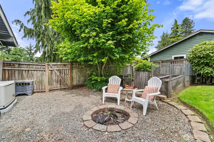 Cozy firepit area perfect for roasting s’mores and relaxing with friends and family. Cozy firepit area perfect for roasting s’mores and relaxing with friends and family.