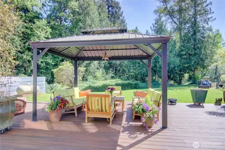 This is a portion of the incredible back deck/patio. There are 2 covered cazebo's, the other gazebo covers a luxurious hot tub/spa