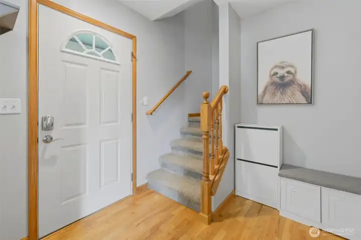 Welcome home!  Your foyer features original hardwoods, plus a roomy closet and guest bath.