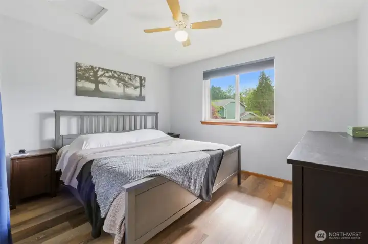 Bedroom 3 upstairs is roomy enough for this king bed, and the same easy-care flooring throughout the upstairs.