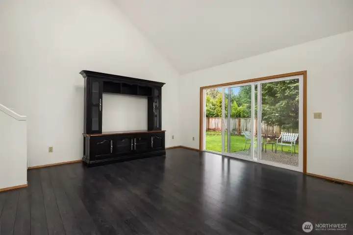 Bonus room that opens to backyard.  Perfect for playroom/ hobbies/ games/ media.