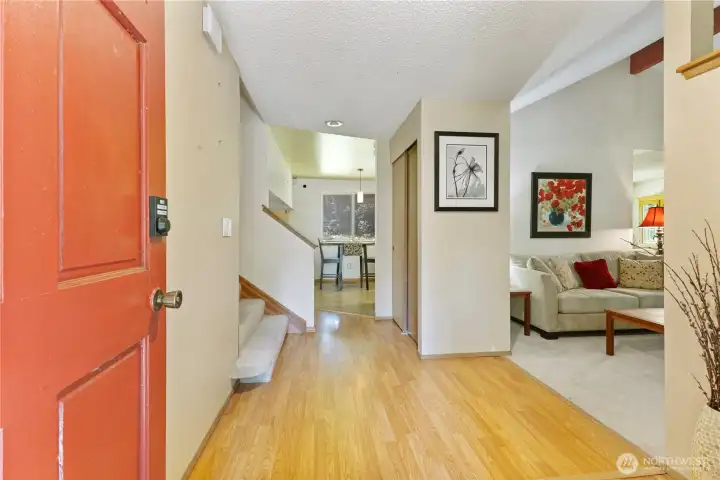 Welcoming entryway leading into home, turn right and you have the front room, large coat closet, ahead you will find kitchen featuring a dinette area, to the left is the wide stairway leading up to bedrooms