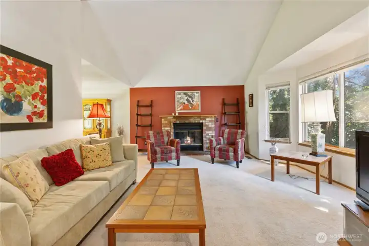 Open and bright living room connects to designated dining area