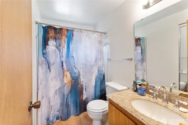 Updated full bath on 2nd floor, with large mirror & granite countertops and chrome fixtures