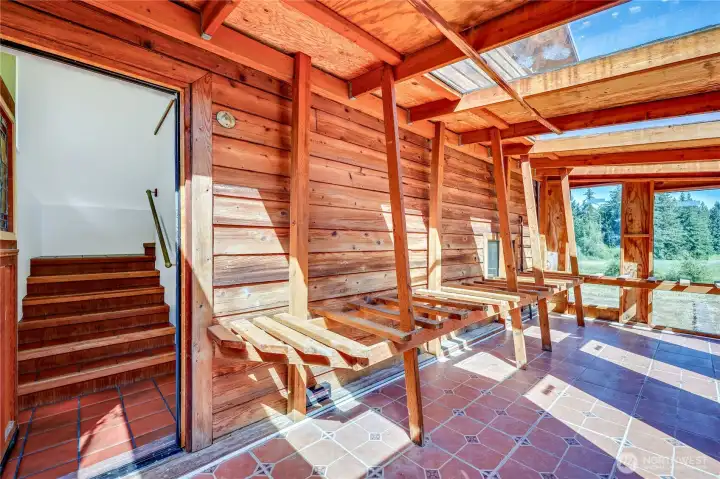 Sunroom. The access is between the upstairs and downstairs Sunroom. The access is between the upstairs and downstairs
