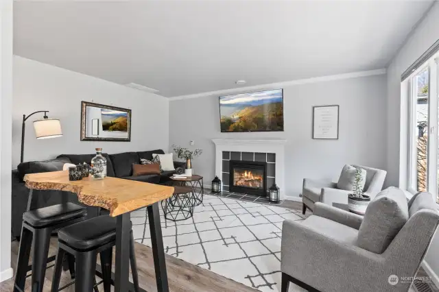 Kitchen opens to the living room with gas fireplace too