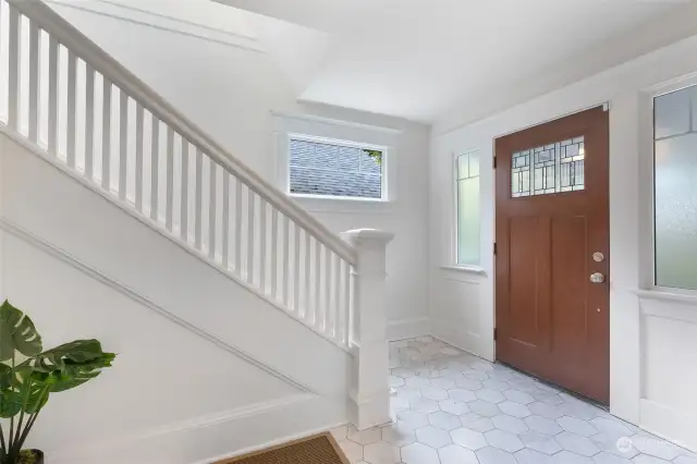 Proper entry with classic open staircase