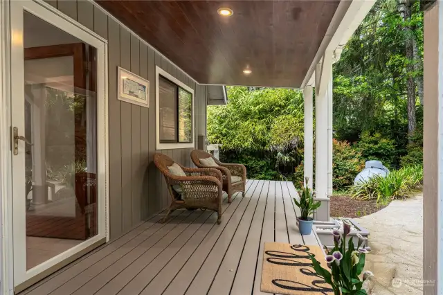 This home has a very welcoming approach.  A covered deck to enjoy on sunnier days!
