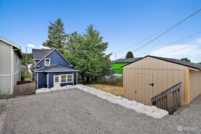 Large backyard space with off-street parking and detached storage shed!