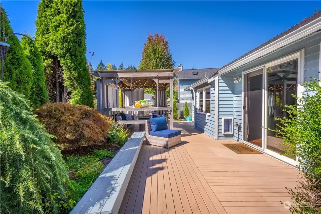 The family room opens up to a private yard and deck, complete with a covered gazebo adorned with lights...plenty of room for entertaining and grilling