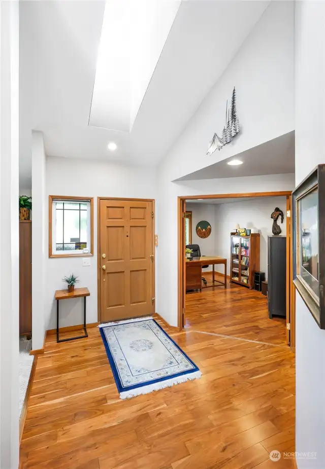 Stunning acacia floors through living areas and skylights that bring in tons of natural light