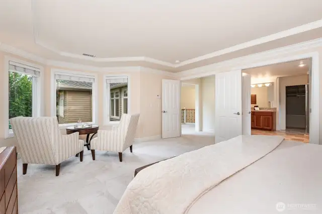 Primary suite looking to the double door entrance & primary bath.