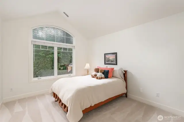Guest bedroom3 with vaulted ceiling and walk-in closet.