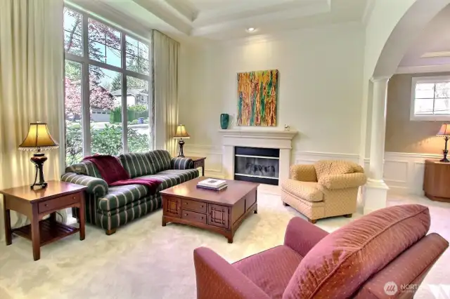 Formal living room with gas fireplace.