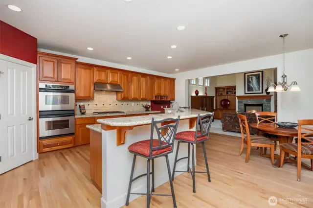 Well appointed kitchen, Pantry, double oven, gas cooktop, breakfast bar and dining area.