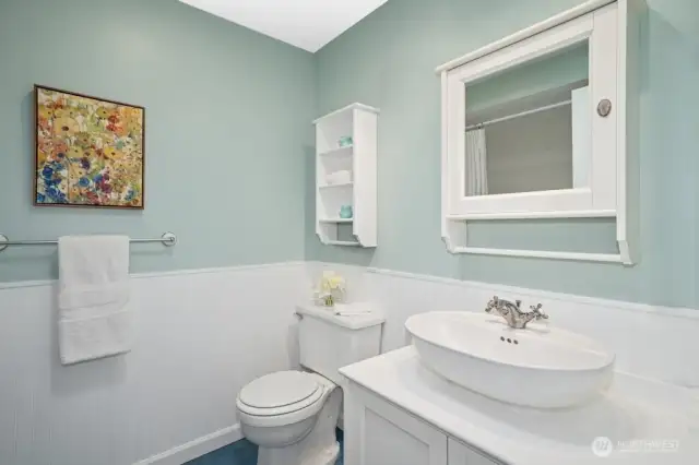 Hall bath on upper floor accommodates second and third bedrooms