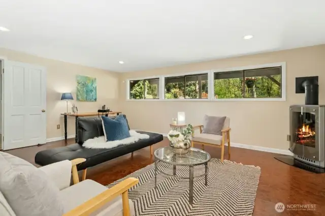 Downstairs family/rec room features gas stove, keeping everyone warm on cold winter nights