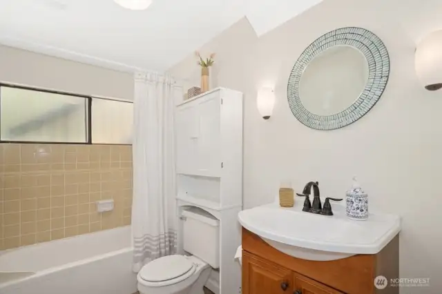 Downstairs bathroom features a shower/tub combo